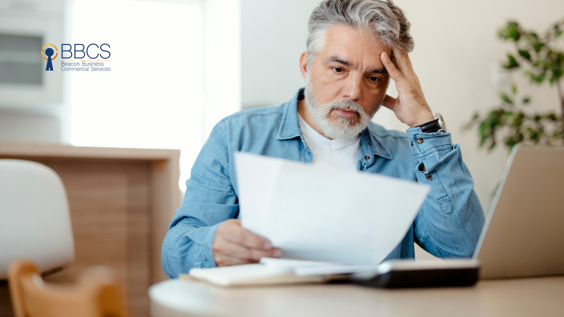 Worried business owner checking bills